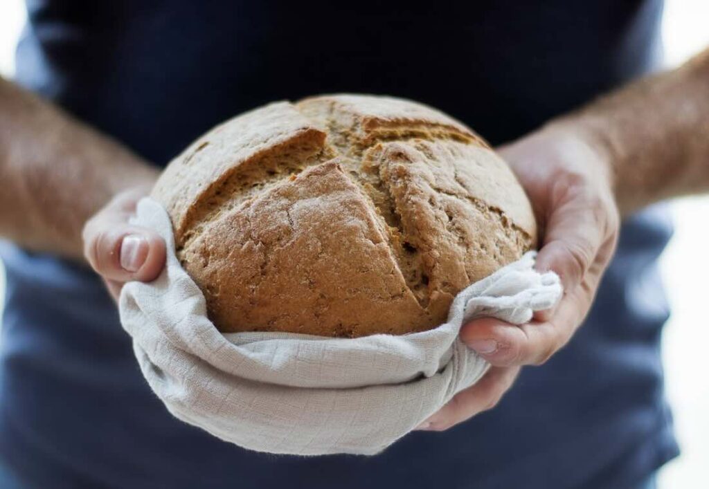 image of bread in someone's hands